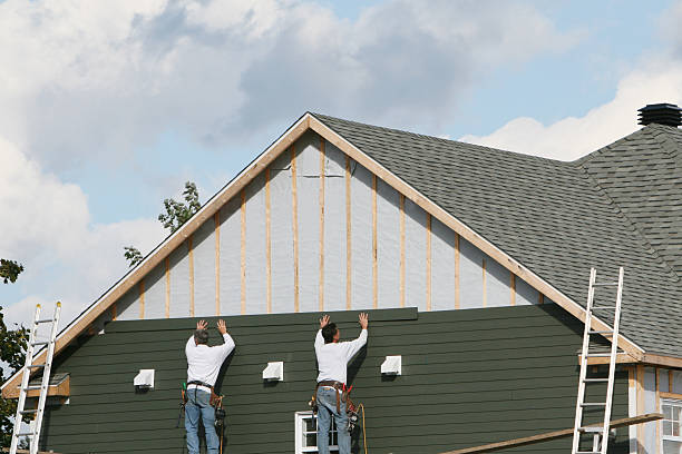 Professional Siding Contractor technician working in Island Park, NY
